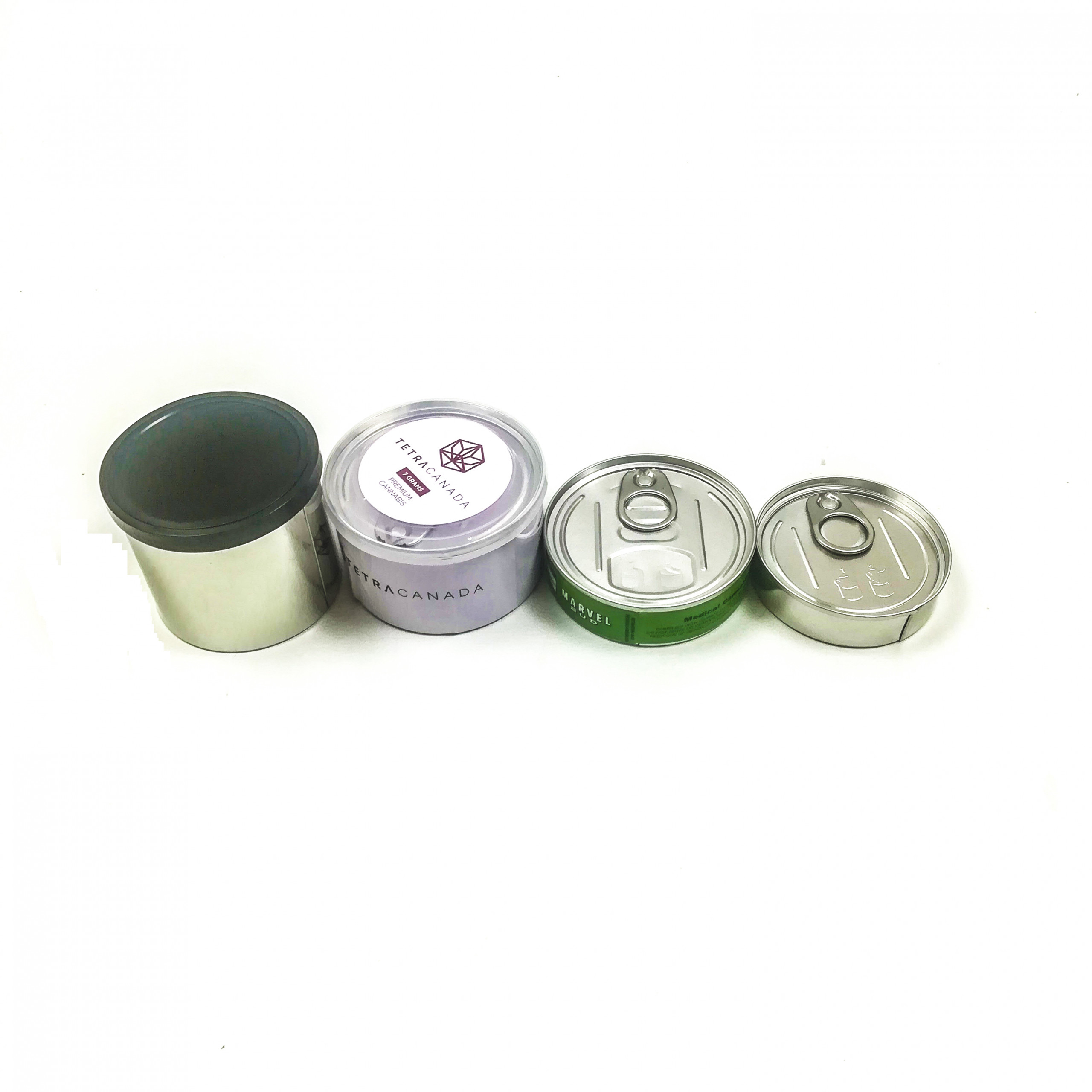 different sizes pressitin tin cans with labels